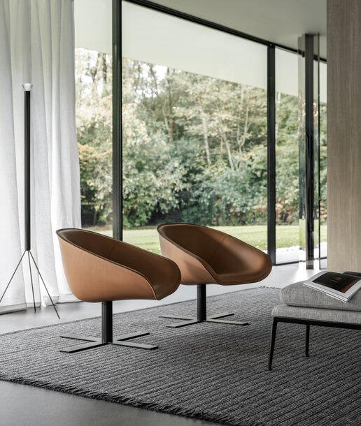10. Ghế lounge armchair chân xoay trong phòng khách